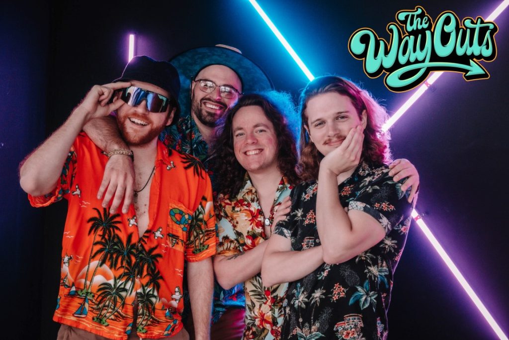 Four men smiling