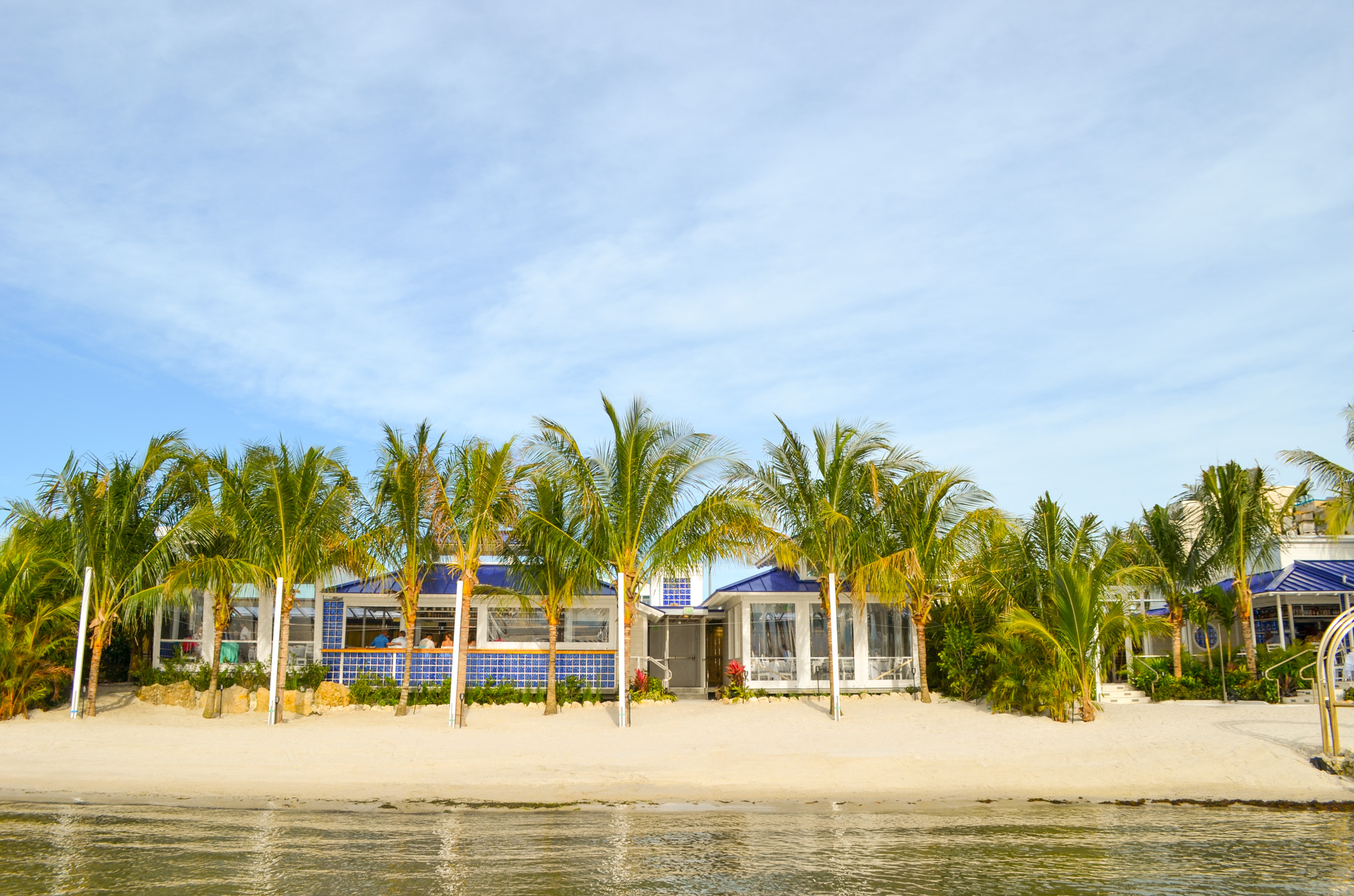 a house on the shore of a tropical island